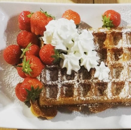 perfect belgian waffle with cream and strawberies